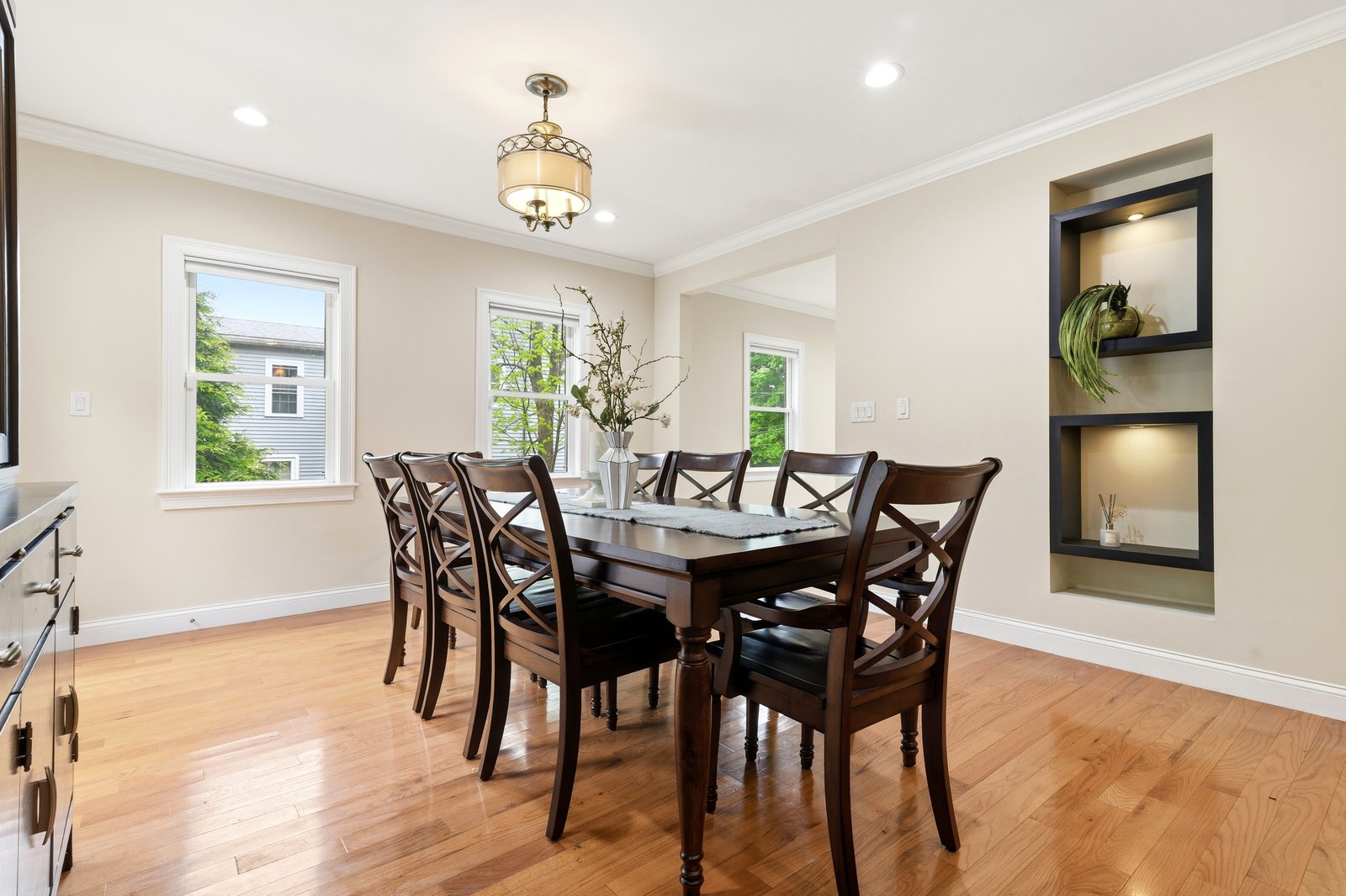 Living room with stone gas fireplace and hardwood floors at 51 Faxon Street